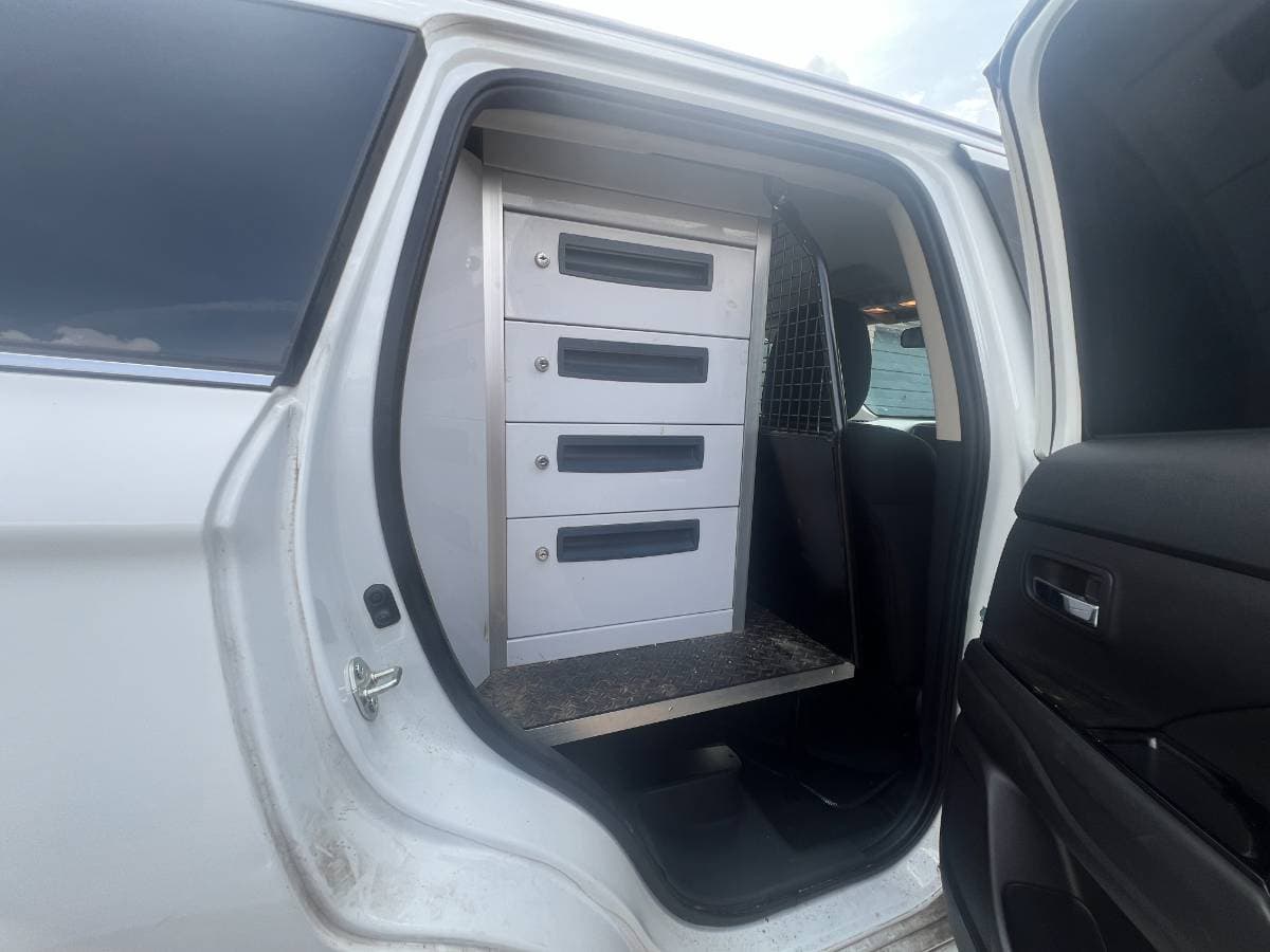 Mitsubishi Outlander 2.4h TwinMotor PHEV Reflex Plus CVT 4WD Commercial Van with fitted internal storage drawers and large boot space. - Image 1